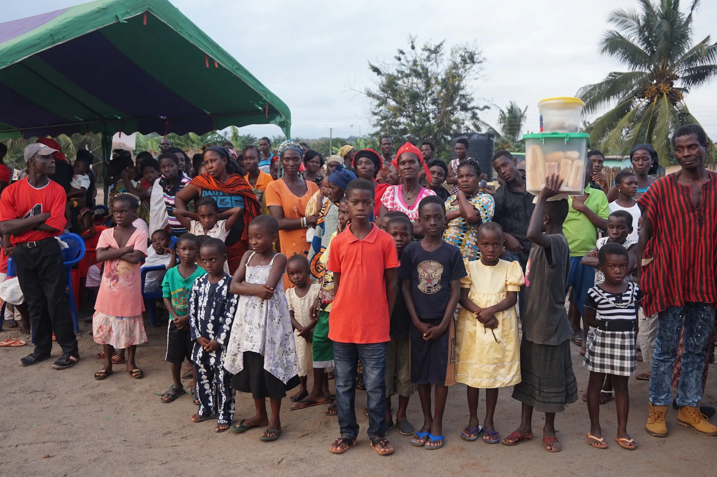 Children and mothers in a community, representing local and global support