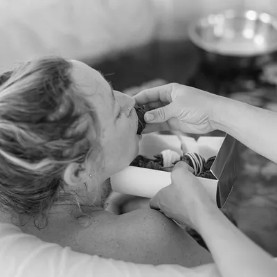 Hands supporting newborn